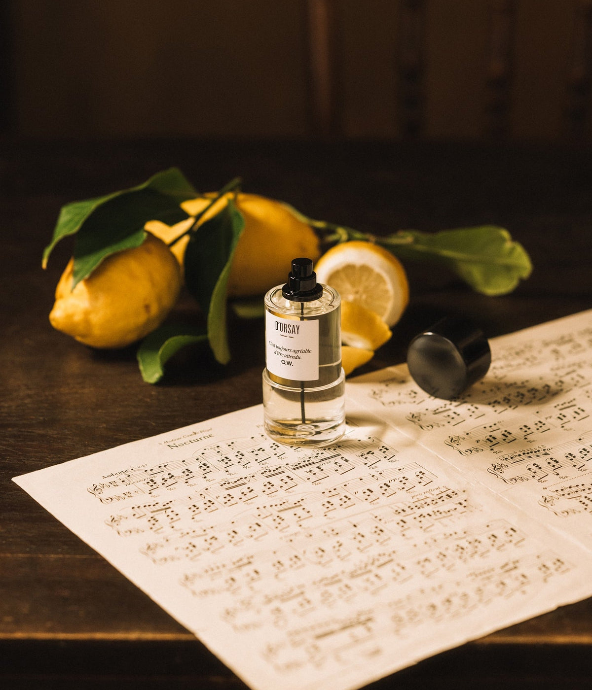 D’Orsay Eau de Parfum O.W. C’est toujours agréable d’être attendu with lemons on old sheet music