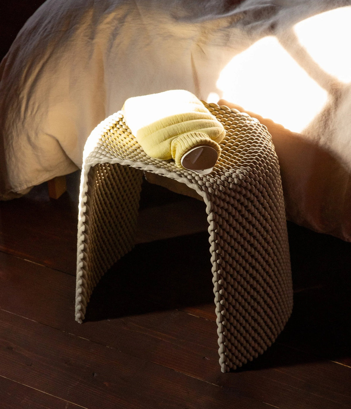 Hot Water Bottle Mini Puffy Butter Yellow – Suite702, on a stool